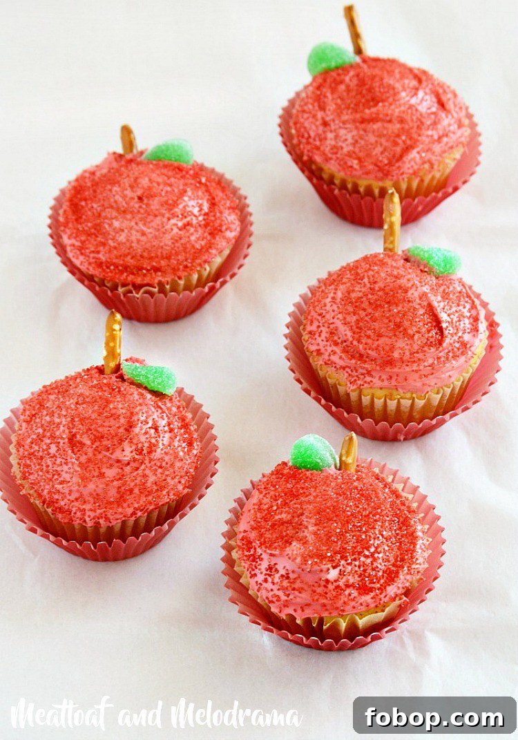 back to school apple cupcakes with pretzel stems and red frosting