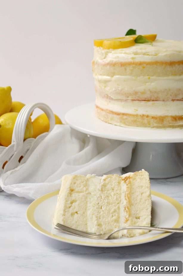 whole lemon naked cake with slice on small plate