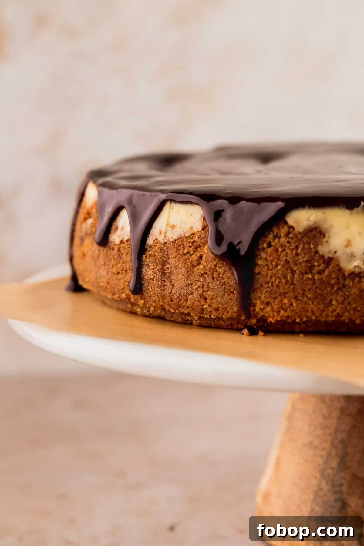 Easter Egg Cheesecake Recipe with Decorative Candy Topping 11 Chocolate ganache dripping down the cheesecake.