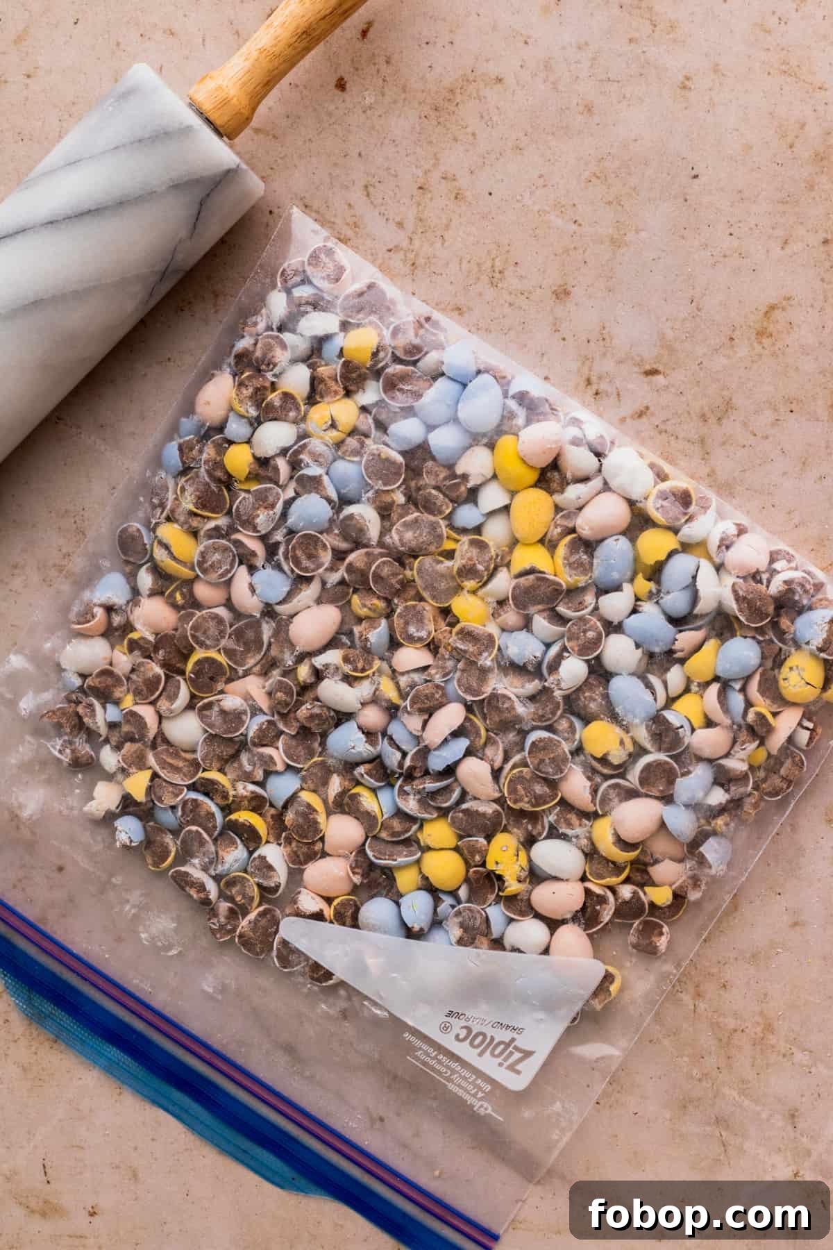 Easter Egg Cheesecake Recipe with Decorative Candy Topping 6 Mini eggs in a bag chopped.