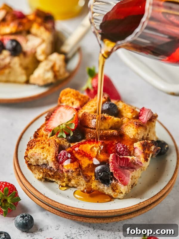 Instant Pot Steak in Rich Homemade Beef Gravy 11 maple syrup being poured over protein french toast casserole with berries