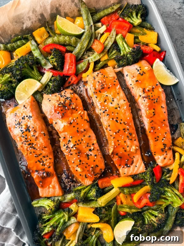 Teriyaki salmon with veggies on a sheet pan.