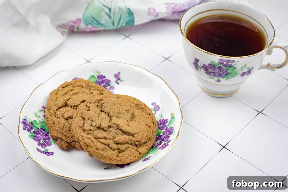 25 Office Cookies Everyone Brings and Raves About 12 A plate of Spiced Ginger Cookies and a cup of tea.