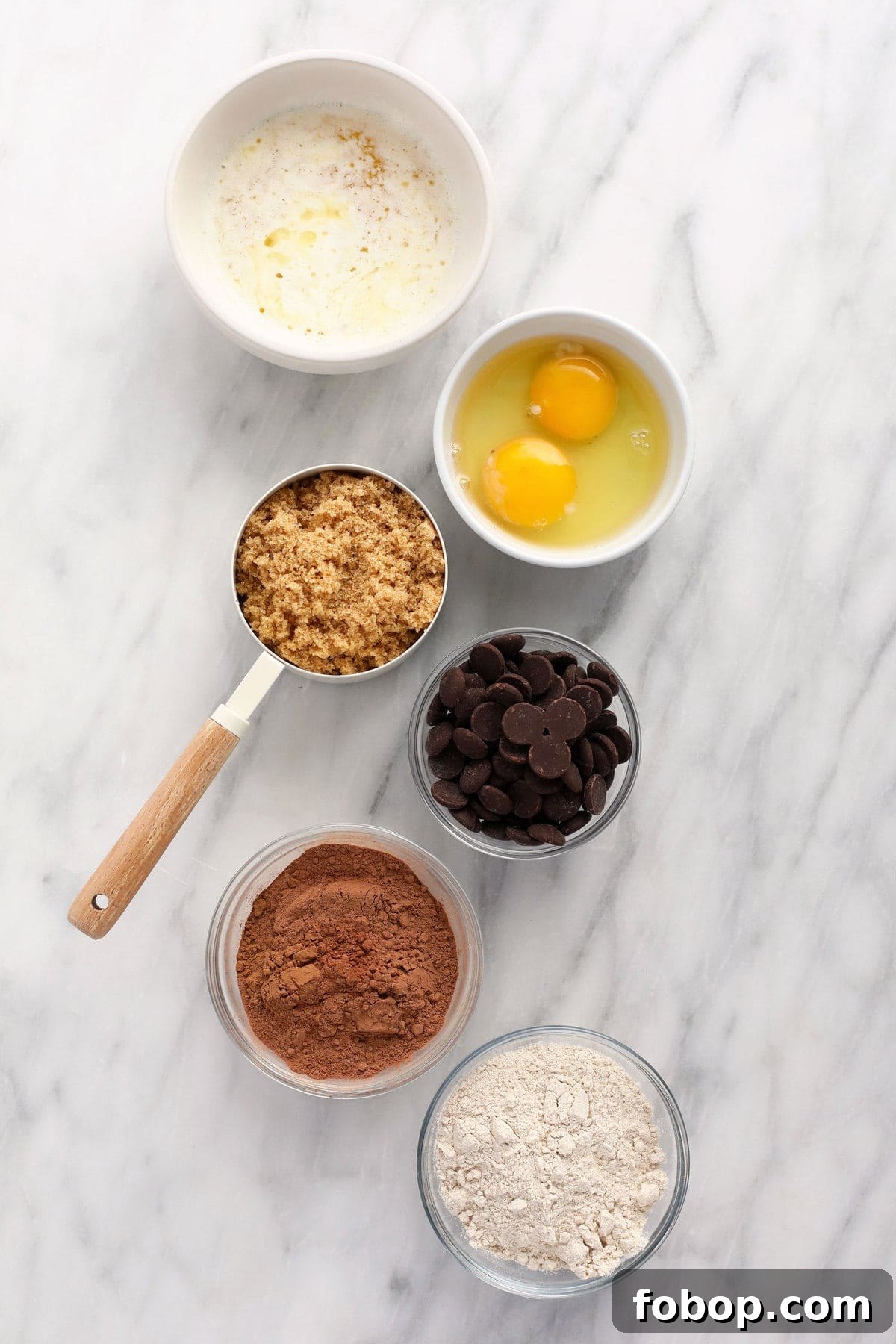 Ooey-gooey homemade fudgy brownies made with simple ingredients. You'll never want to eat another fudgy brownie recipe again! butter, eggs, brown sugar, chocoalte chips, cocoa powder, and flour