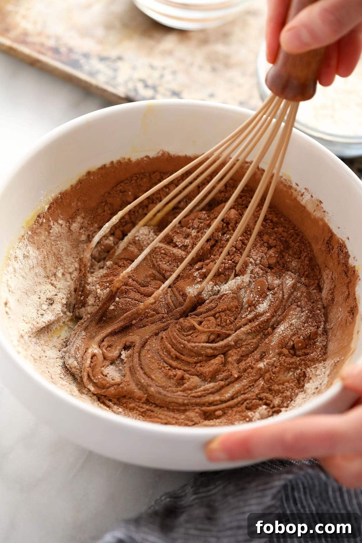 Ooey-gooey homemade fudgy brownies made with simple ingredients. You'll never want to eat another fudgy brownie recipe again! whisking together flour and cocoa powder