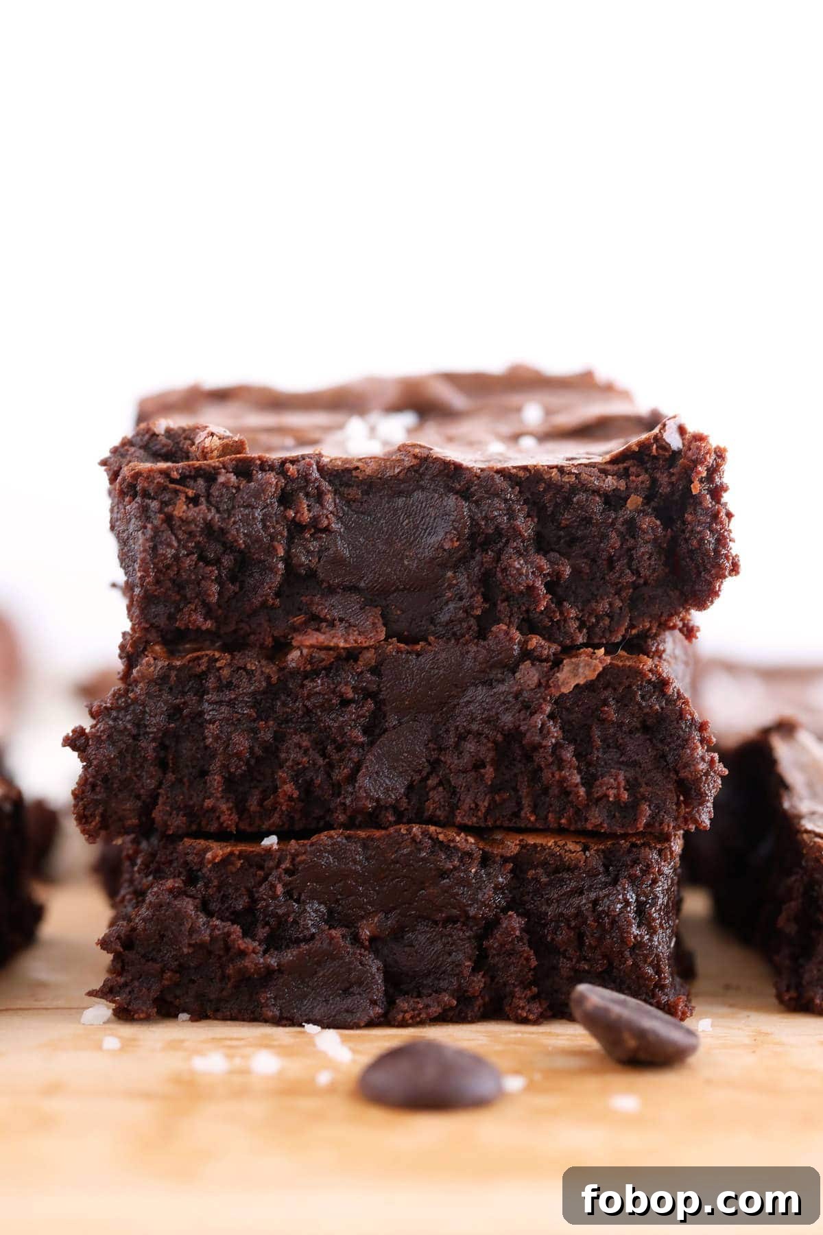 Ooey-gooey homemade fudgy brownies made with simple ingredients. You'll never want to eat another fudgy brownie recipe again! 3 brownies stacked on eachother