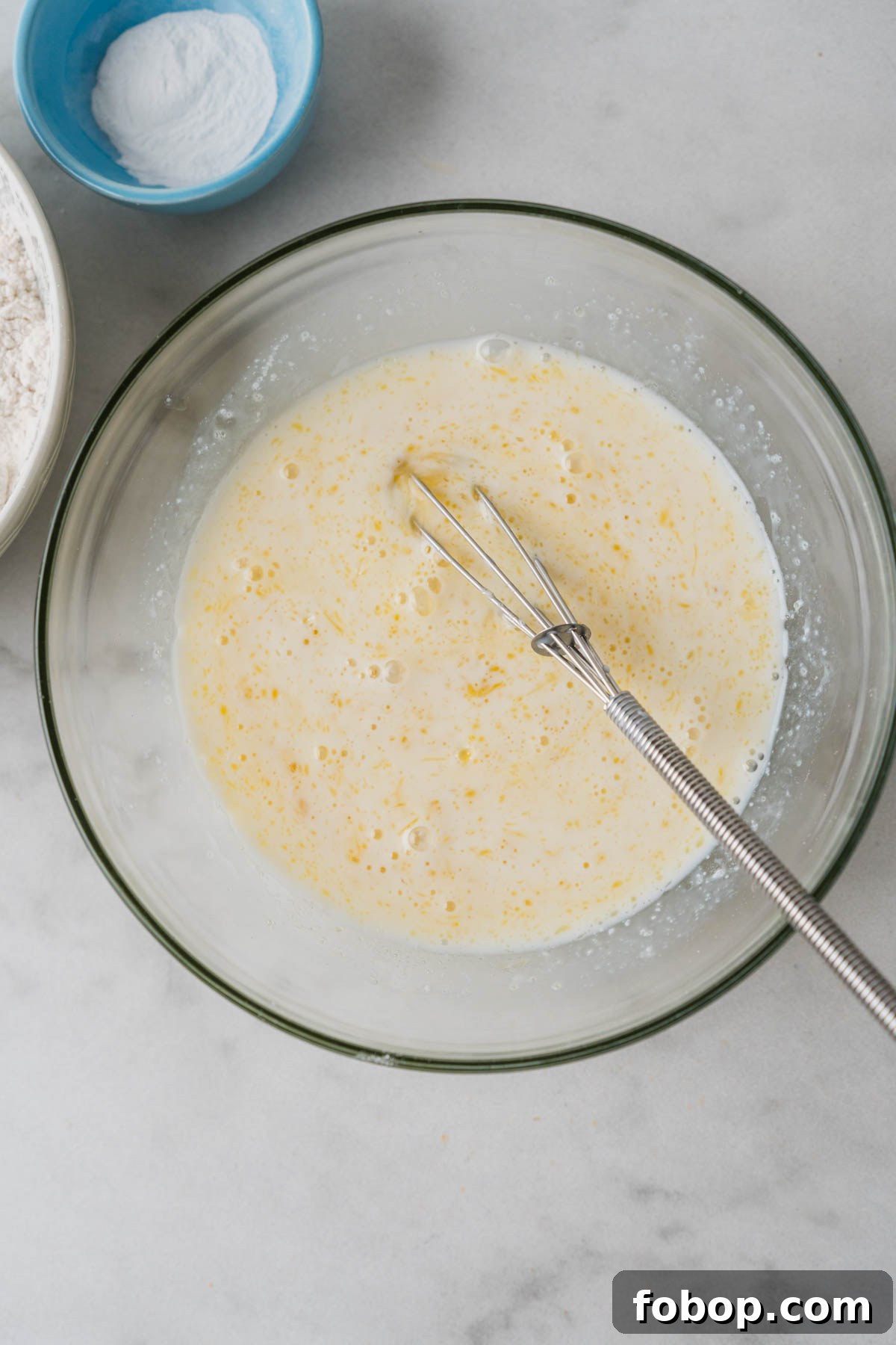 mixing wet ingredients for air fryer pancakes.