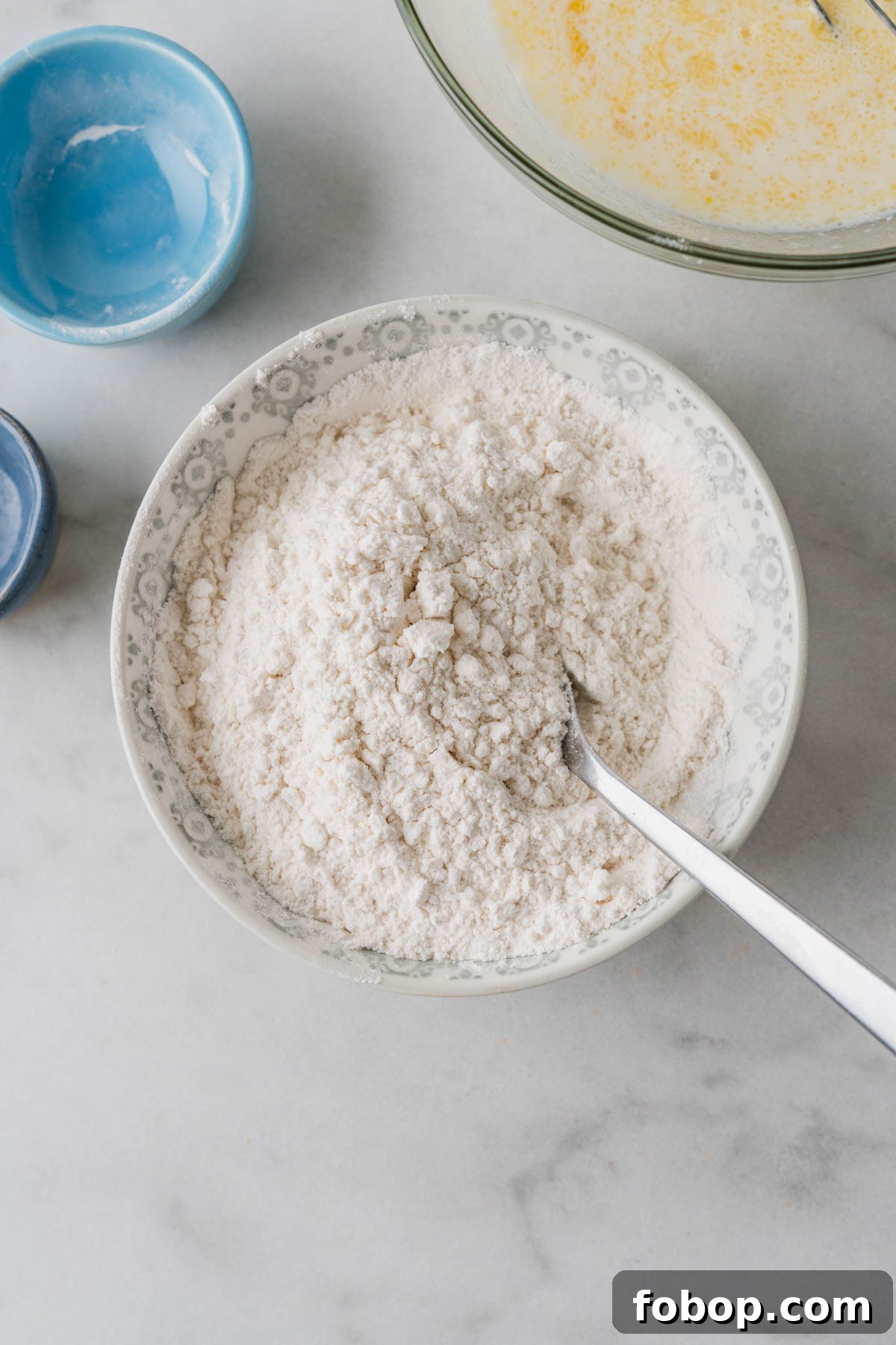 mixing dry ingredients for air fryer pancakes.