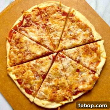 Crispy Cracker-Crust Pizza Recipe: Thin, Crunchy Homemade Pie 13 overhead shot of pizza cut into slices