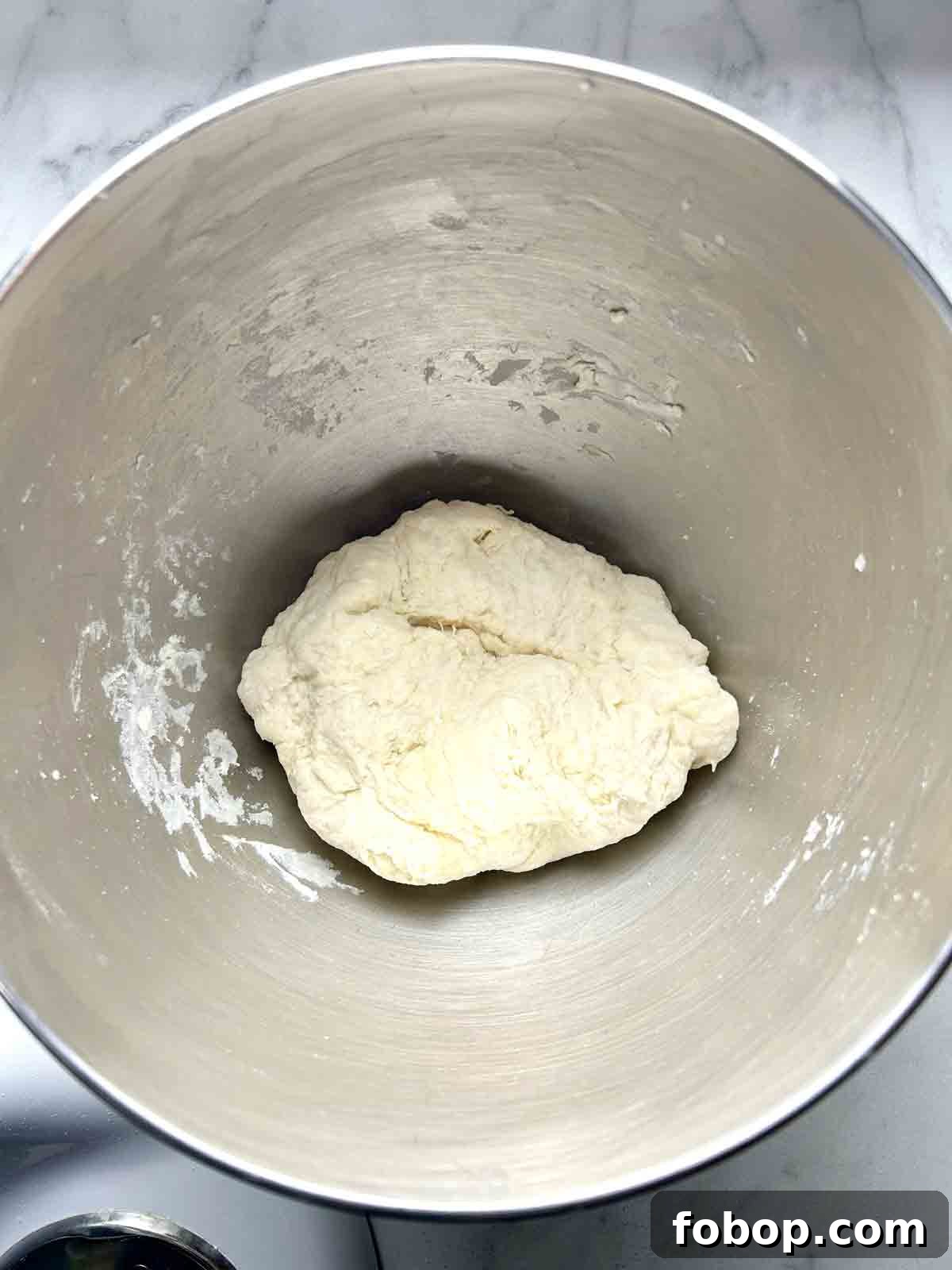Crispy Cracker-Crust Pizza Recipe: Thin, Crunchy Homemade Pie 4 scraggly dough in mixing bowl