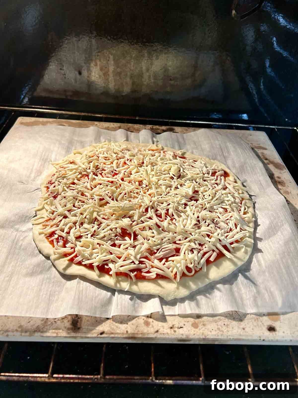 Crispy Cracker-Crust Pizza Recipe: Thin, Crunchy Homemade Pie 10 pizza being baked on pizza stone