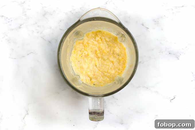 Summer Corn Chowder with Garlic Herb Bread: Creamy Seasonal Recipe 8 Blending cooked corn to make a thicker corn chowder.