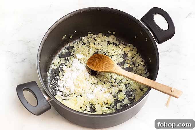 Summer Corn Chowder with Garlic Herb Bread: Creamy Seasonal Recipe 6 Cooking onions with flour to create a thick base for the best corn chowder.