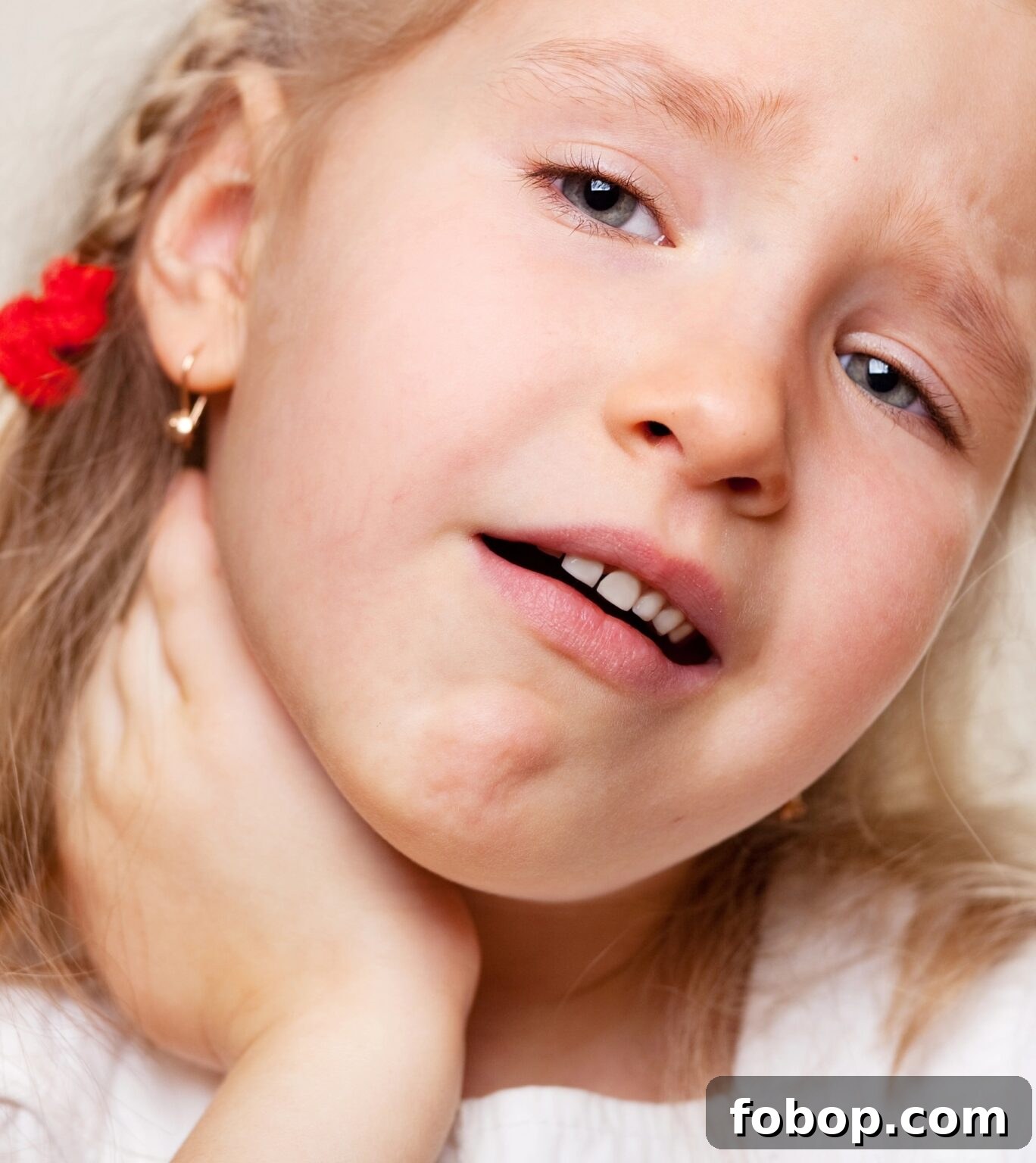 Soothe a Sore Throat with Marshmallows: Gentle Home Remedies 3 girl holding sore throat