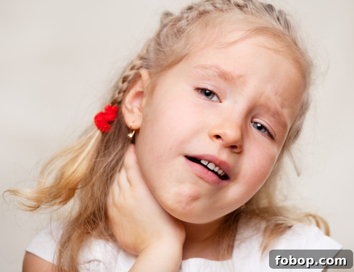 Soothe a Sore Throat with Marshmallows: Gentle Home Remedies 5 little girl holding sore throat