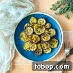 Air fryer zucchini and squash on a blue plate.