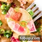 A close-up of Bavarian potato salad with bacon pieces.
