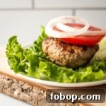 A turkey burger lettuce wrap on a plate.