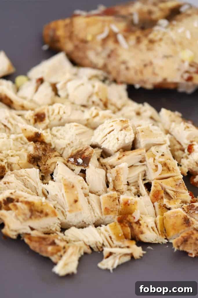 Slow Cooker Chicken Burrito Bowls Recipe for Weeknight Meals 4 diced cooked chicken for making chicken burrito crock pot recipe.