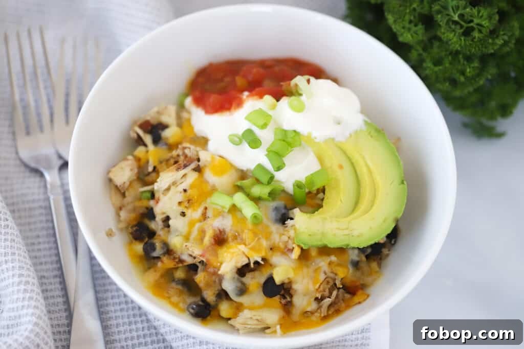 Slow Cooker Chicken Burrito Bowls Recipe for Weeknight Meals 5 slow cooker burrito bowl with chicken and burrito bowl toppings.