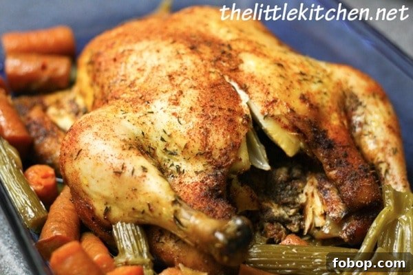 Slow Cooker Whole Chicken in a blue baking dish
