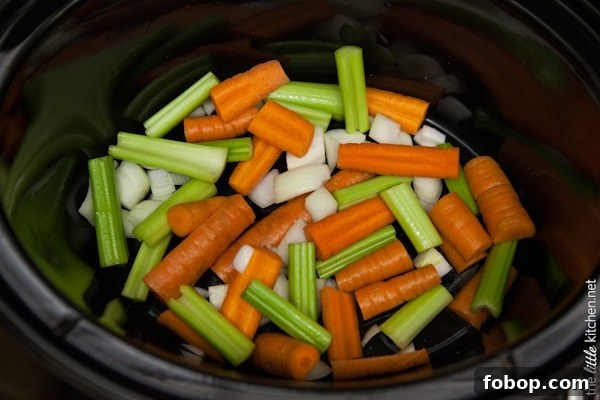 Slow Cooker Whole Chicken from TheLittleKitchen.net Carrots, Celery and Onions in a slow cooker