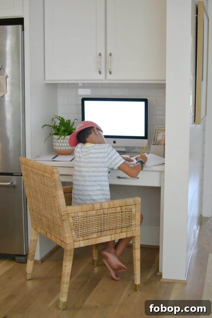 How to Begin Organizing Your Home: A Simple Room-by-Room Plan 12 boy at kitchen desk working