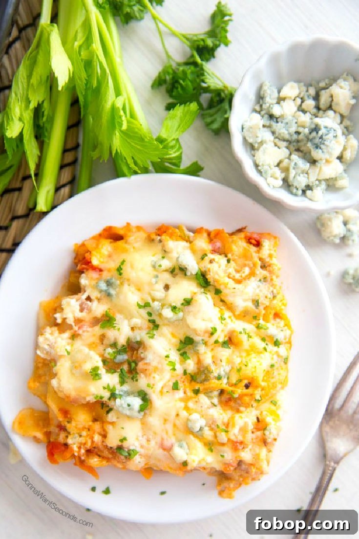 A single serving of Buffalo Chicken Lasagna on a white plate