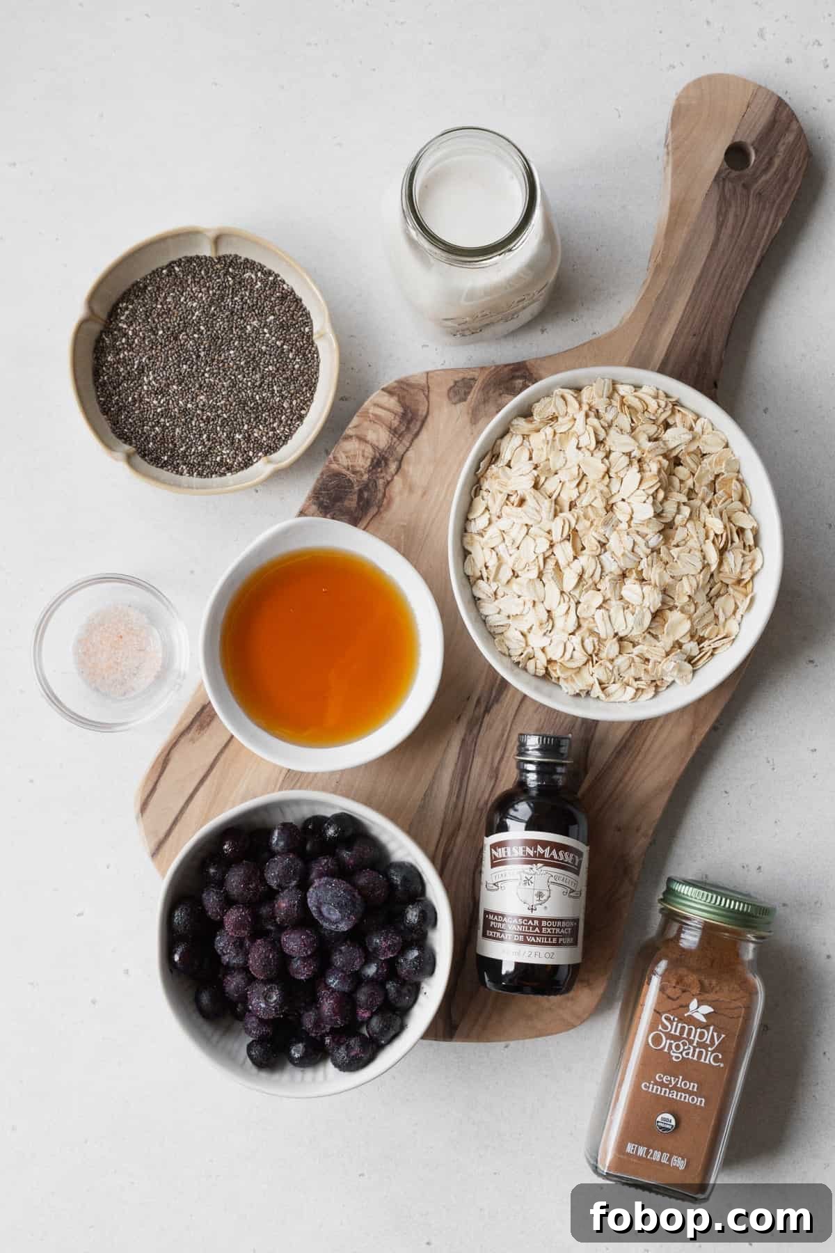 Creamy Blueberry Overnight Oats Recipe for Quick Breakfast 3 Ingredients to make blueberry overnight oats measured out into bowls.