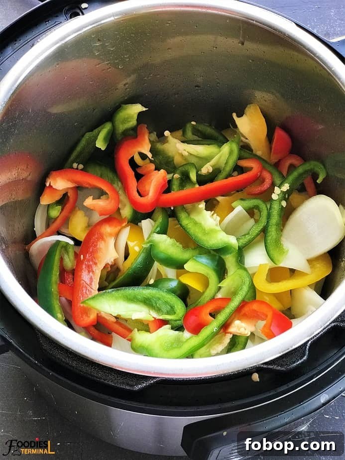 Instant Pot Sausage with Peppers and Onion Dinner 3 Colorful bell peppers and onions in instant pot