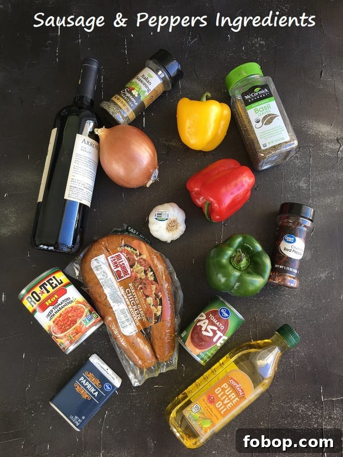 Instant Pot Sausage with Peppers and Onion Dinner 5 sausage peppers and onions ingredients on a black surface