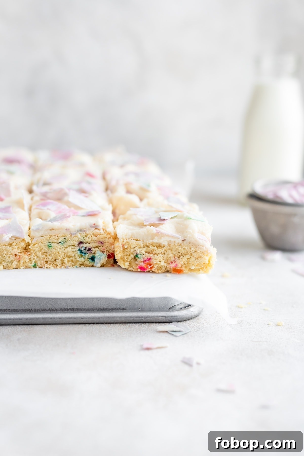 cookie bars on baking sheet and parchment paper 