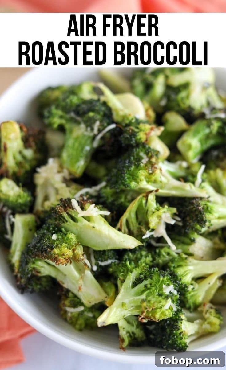Crispy Garlic Lemon Air Fryer Broccoli Recipe 2 broccoli air fried in white serving bowl with parmesan on top