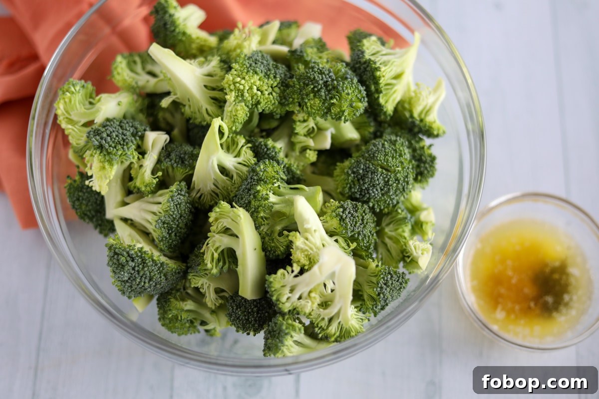 Crispy Garlic Lemon Air Fryer Broccoli Recipe 3 raw broccoli with butter and olive oil mixture