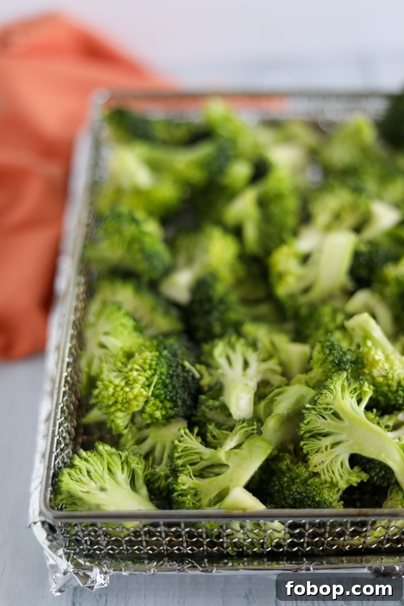 Crispy Garlic Lemon Air Fryer Broccoli Recipe 5 Broccoli florets in air fryer basket