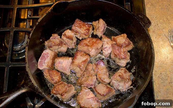Beef and Guinness Stew with Homemade Guinness Beer Bread 5 Beef being browned in cast iron dutch oven
