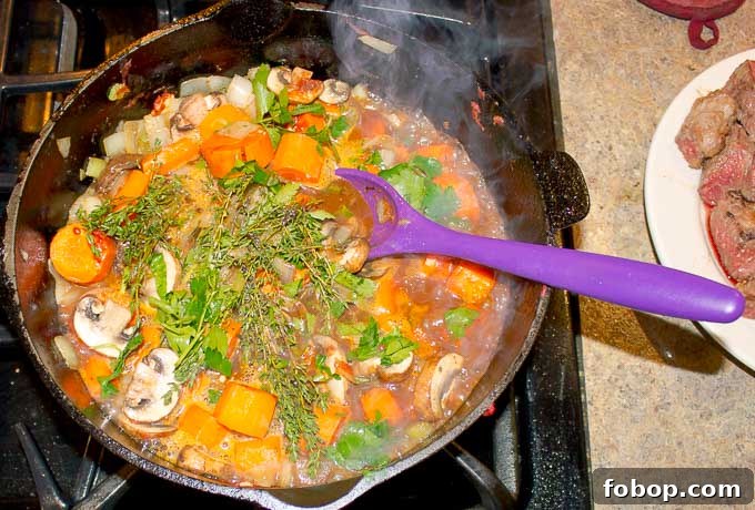 Beef and Guinness Stew with Homemade Guinness Beer Bread 6 Beef and Guinness Stew being cooked in dutch oven