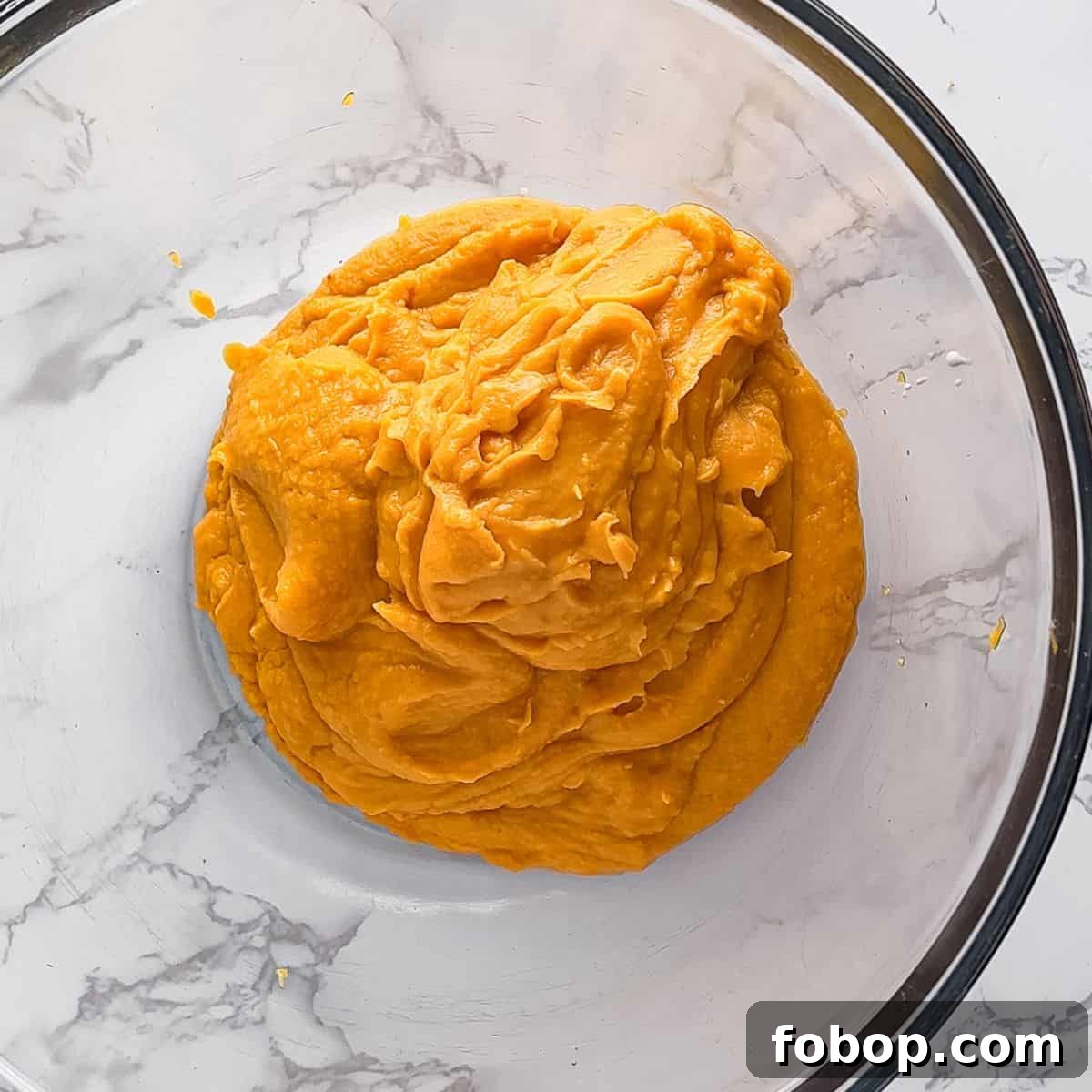 Ultimate Homemade Sweet Potato Pie Recipe for Any Occasion 5 Mashed sweet potatoes in a bowl.