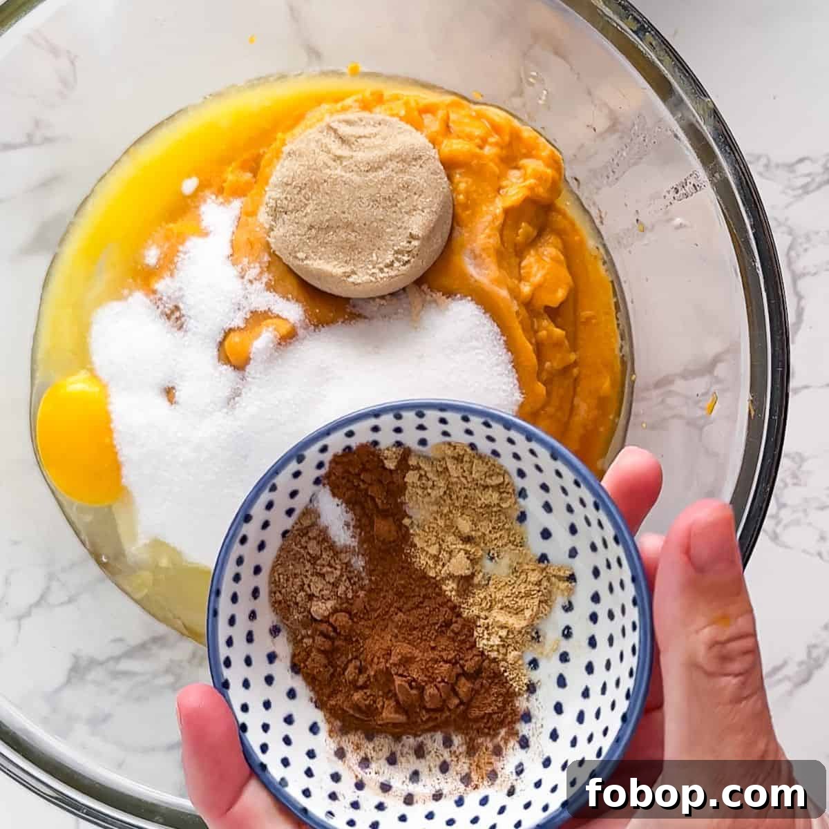 Ultimate Homemade Sweet Potato Pie Recipe for Any Occasion 6 Adding the spices, eggs and sugar to the sweet potatoes.