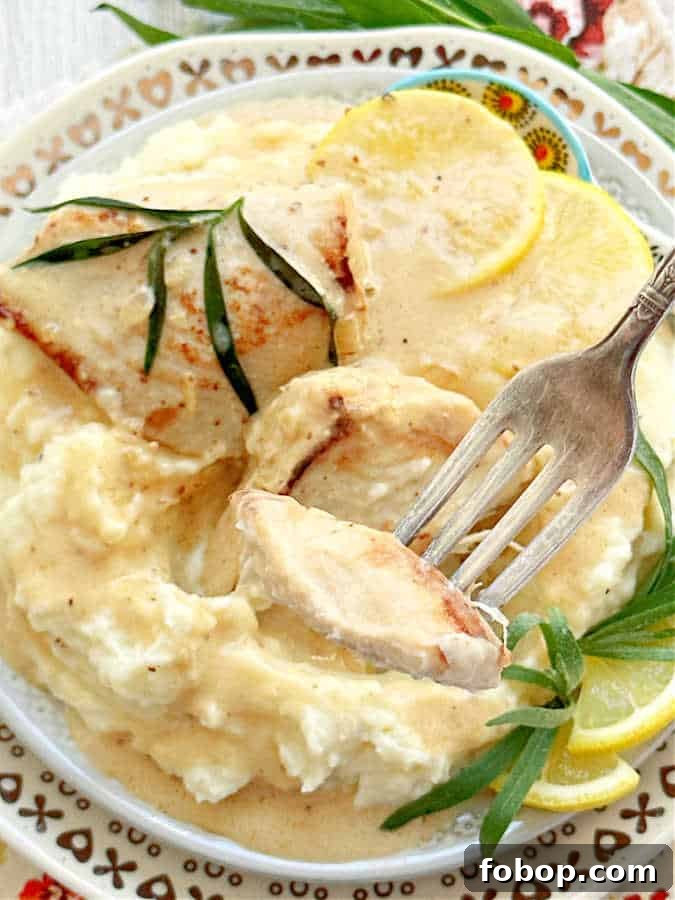 Creamy Tarragon Chicken Recipe with White Wine and Garlic 10 taking a bite of chicken tarragon