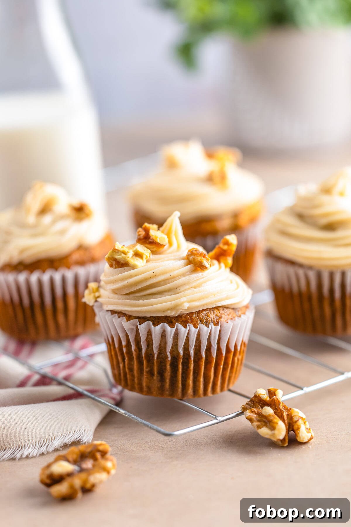 banana cupcakes recipe on a wire rack with walnuts
