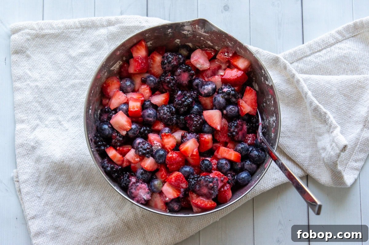 a bowl of chopped mixed berries.