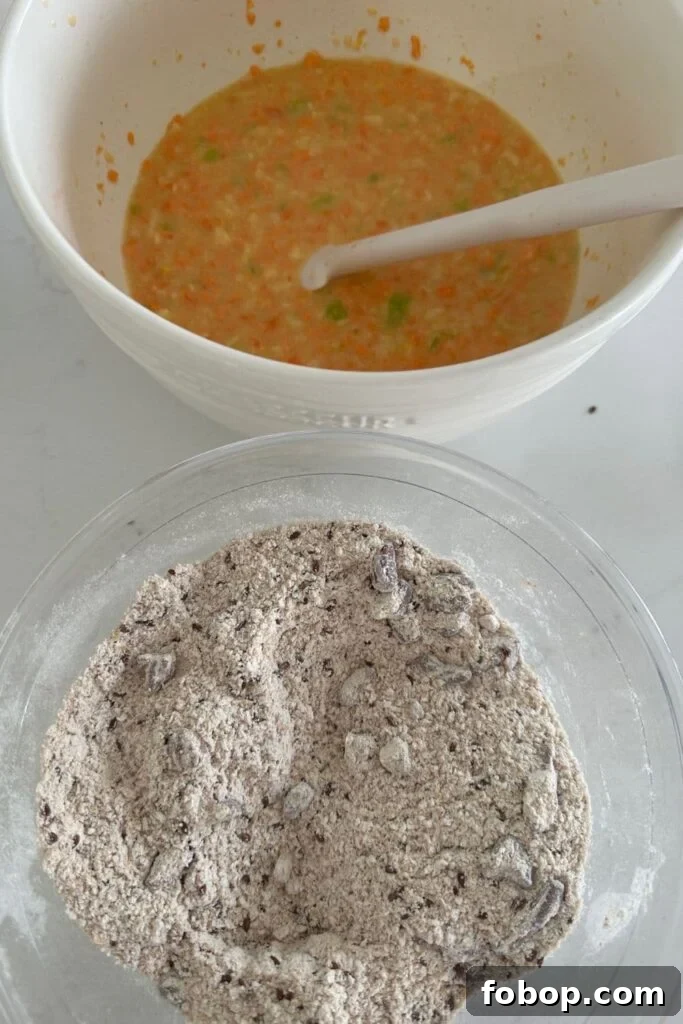 A bowl of wet ingredients and a bowl of dry ingredients ready to be mixed together to make Sourdough Morning Glory Muffins.