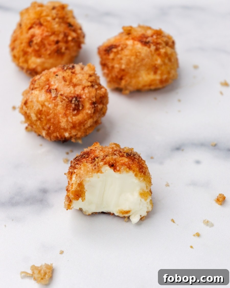 Crispy Air Fryer Carnivore Cream Cheese Bites 9 Air Fryer Crispy Carnivore Cream Cheese Bites with bite taken out separated view