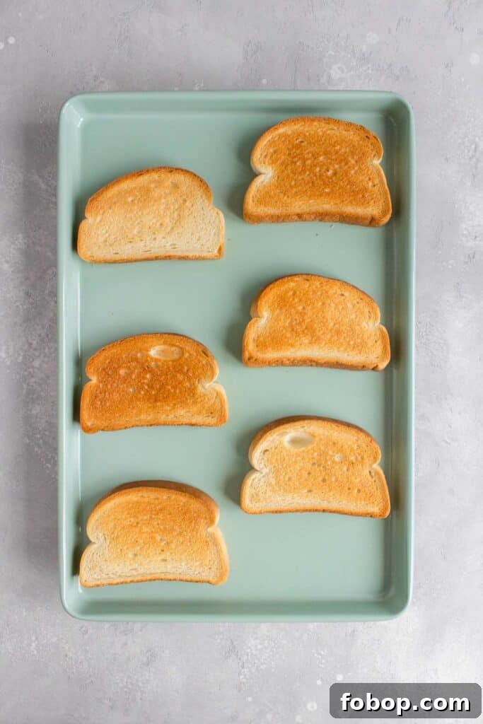 Oven Toasted Bread: How to Toast Slices Perfectly Every Time 5 Bread toasted in the oven on a sheet pan.