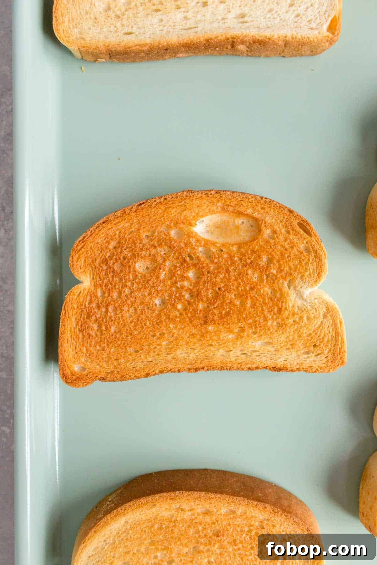 Oven Toasted Bread: How to Toast Slices Perfectly Every Time 7 Close up of bread toasted in the oven.