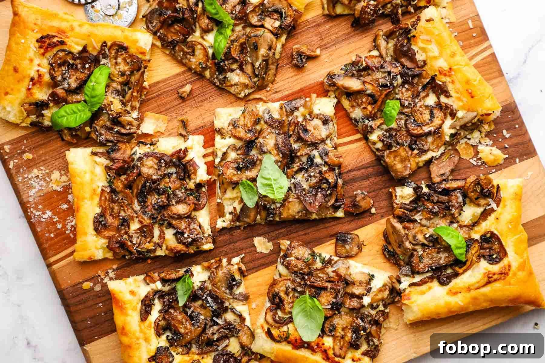 Savory Mushroom Tart with Caramelized Onions and Thyme 3 overhead view of mushroom tart on a cutting board