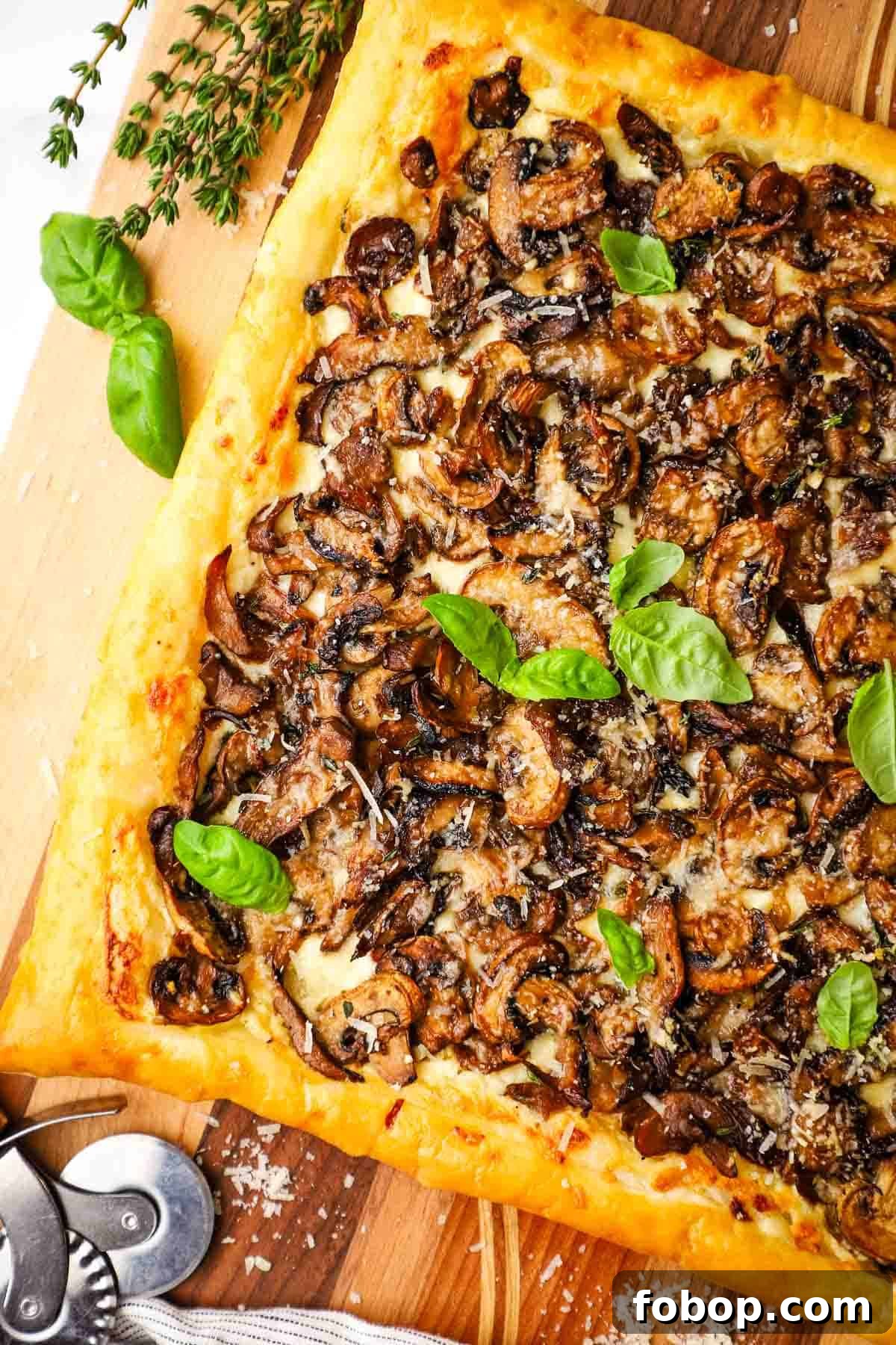 Savory Mushroom Tart with Caramelized Onions and Thyme 8 overhead view of mushroom tarts on a cutting board