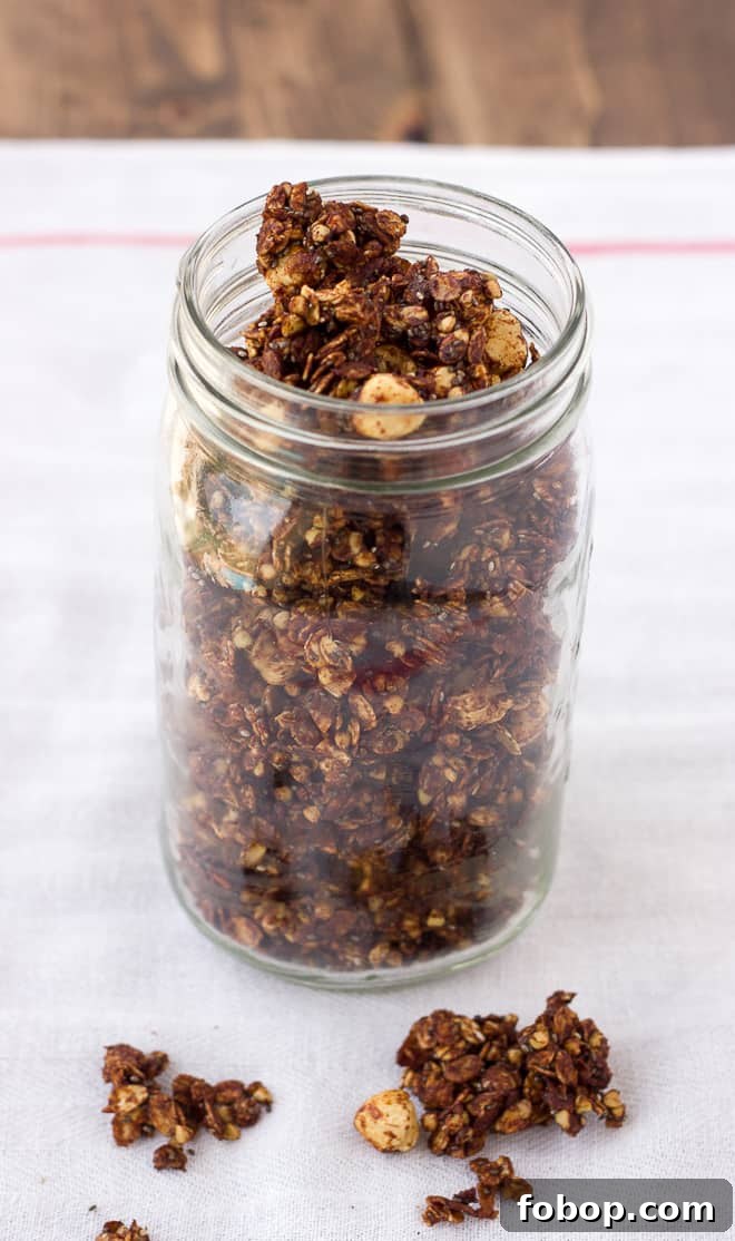 Chocolate Hazelnut Granola — Gluten Free & Dairy Free Recipe 3 jar of chocolate granola on white dish towel