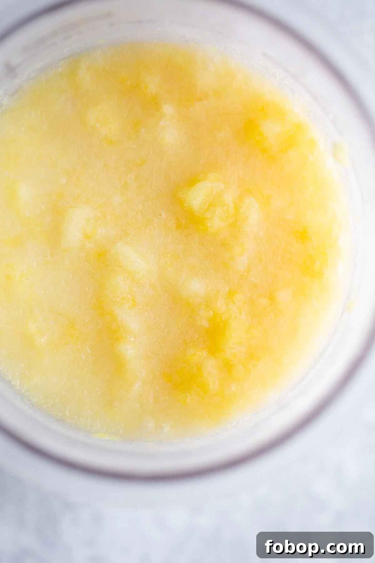 Make Dole Whip with Your Ninja Creami: Simple Recipe Guide 5 Frozen dole whip in Ninja creami container